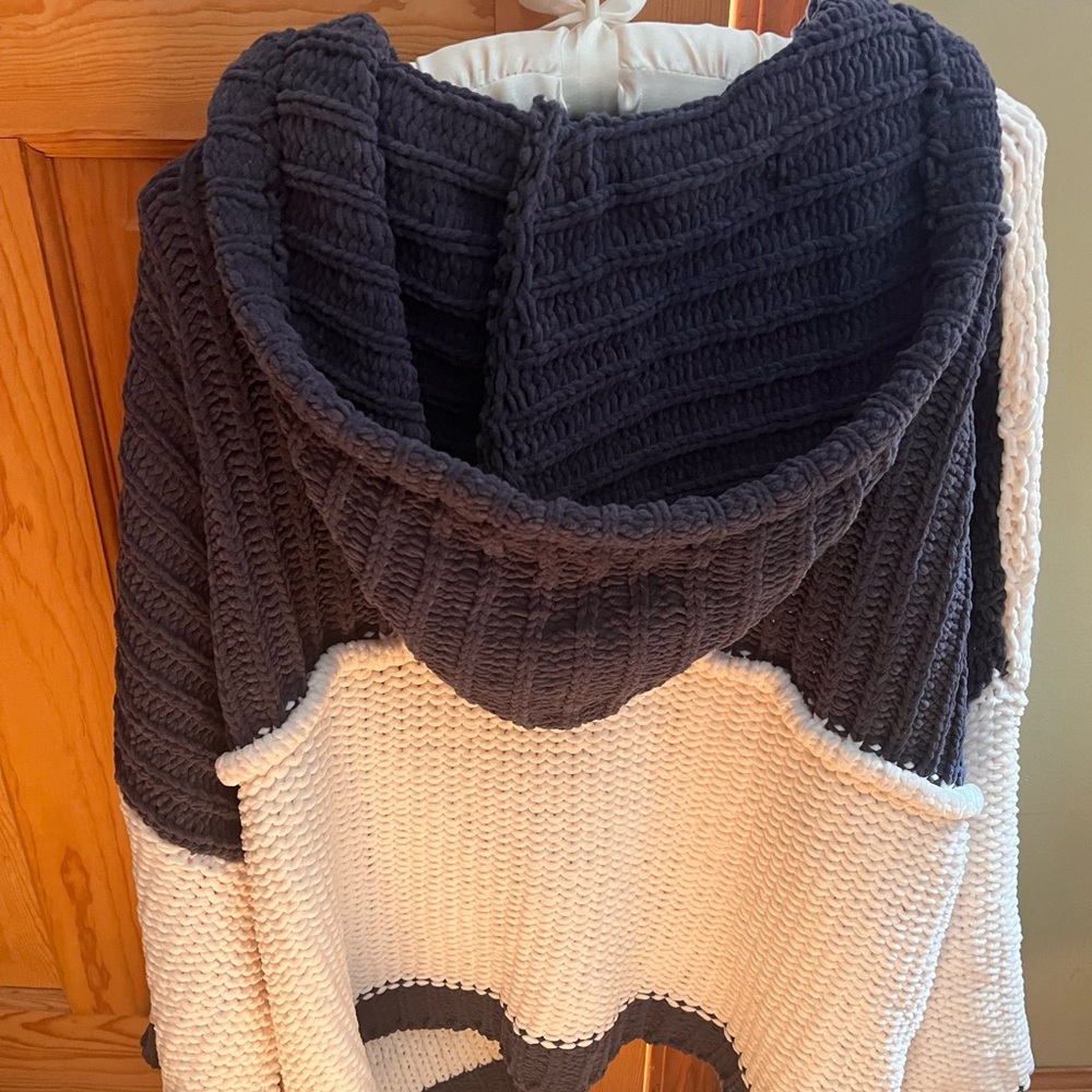 Cute, warm sweater, pullover with buttons and hood. Goes great with jeans!